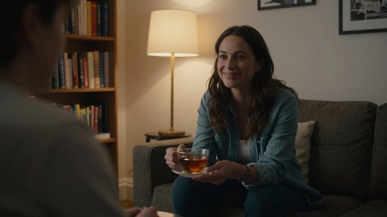 An independent escort offering tea to a client in a cozy, personal apartment setting.