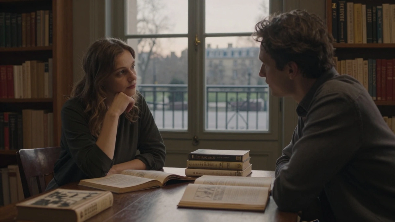 Two people engage in quiet conversation over books in a library, with a park visible through the window.