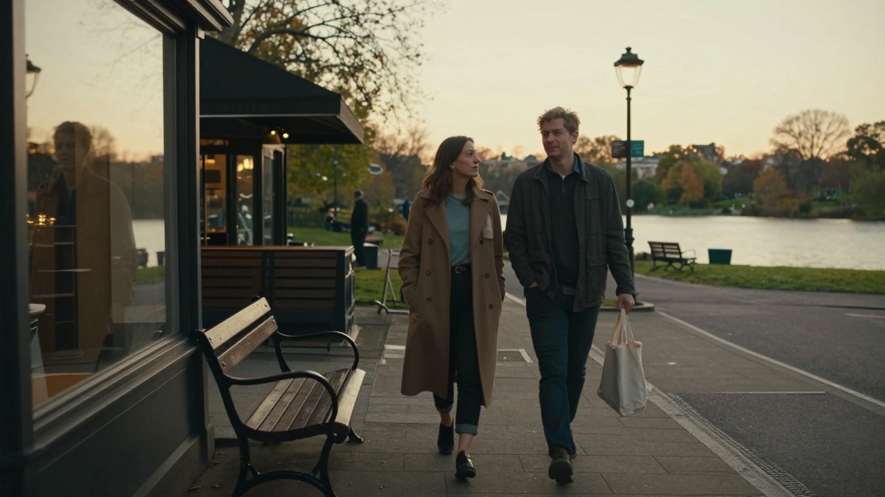 A man and woman walking peacefully in Hyde Park during golden hour, enjoying quiet companionship.