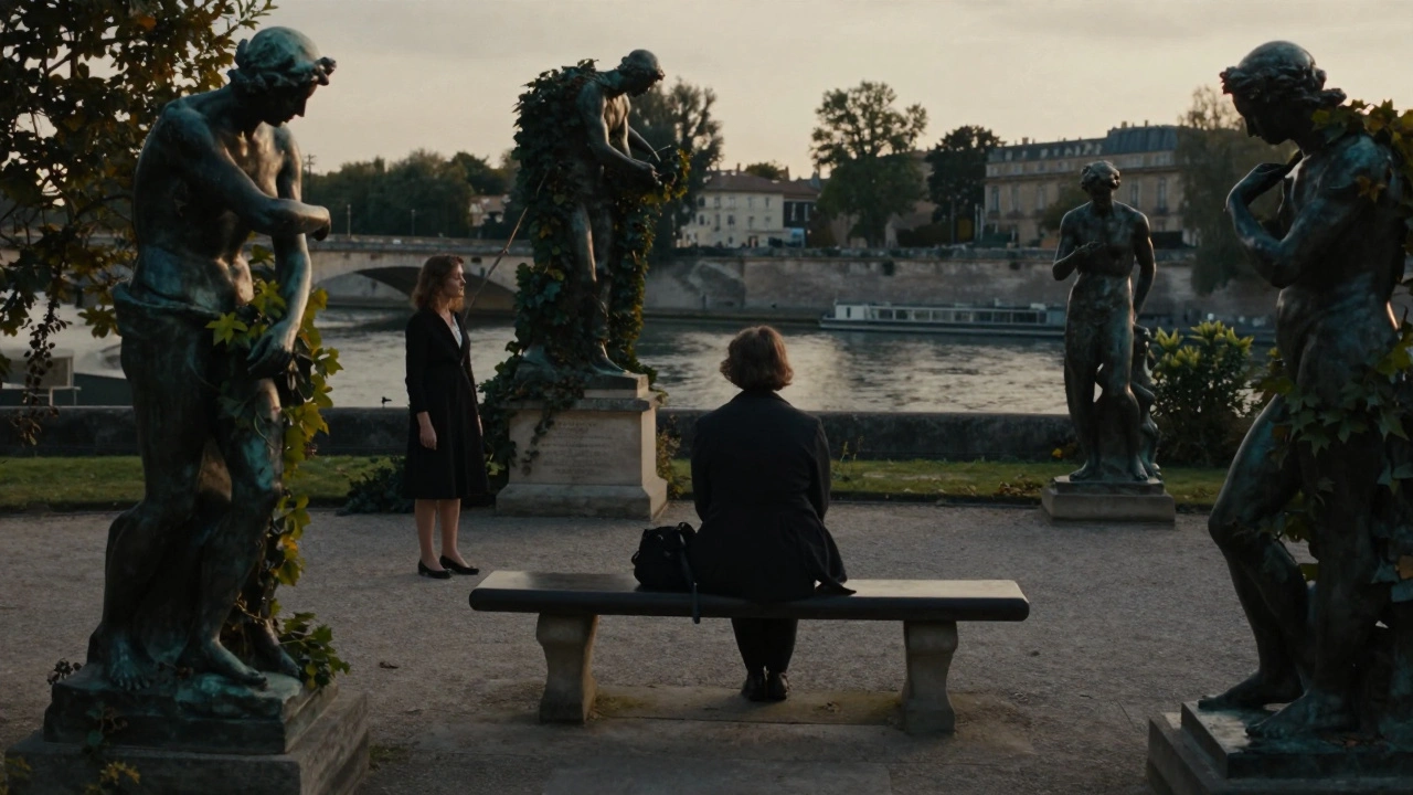 A solitary figure sits in the Musée Rodin garden at sunset, with a woman standing nearby, offering quiet presence.